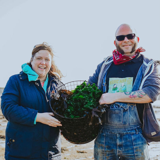 Naomi & Ben with a basket of cut seaweed