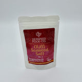 Pouch of mild chilli seaweed salt on a white background 