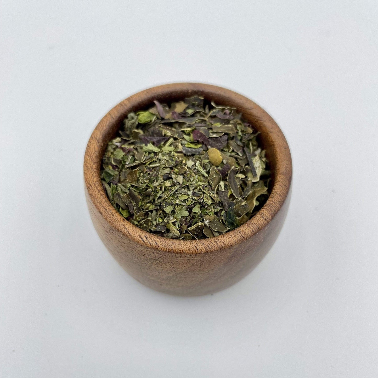herby seaweed seasoning in a wooden pot