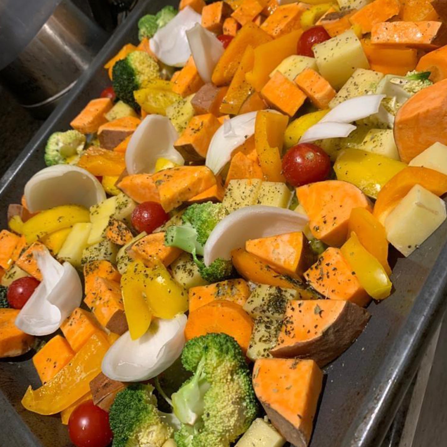 The Seaweed Food Co. Seasonings Herby Seaweed Seasoning on tray of mixed vegetables ready to go into the oven